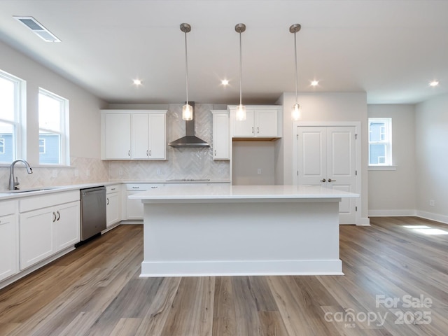 7004 Impulse Ct, Charlotte, NC 28205 - kitchen featuring a kitchen island, white cabinets, backsplash, and recessed lighting
