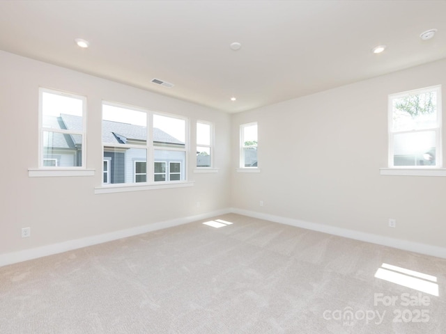 7004 Impulse Ct, Charlotte, NC 28205 - empty room with light carpet, plenty of natural light, and recessed lighting
