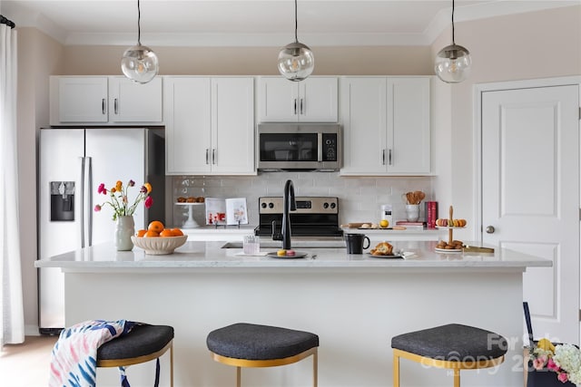 2308 Endeavor Run, Charlotte, NC 28269 - kitchen with appliances with stainless steel finishes, backsplash, a breakfast bar, white cabinetry, and ornamental molding