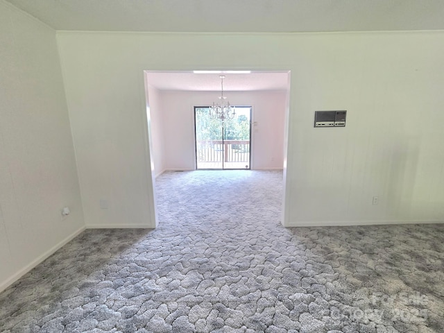 717 2nd St SW, Conover, NC 28613 - carpeted empty room featuring a chandelier and ornamental molding