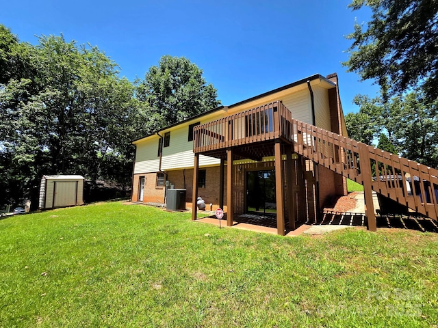 717 2nd St SW, Conover, NC 28613 - rear view of house featuring a storage shed, stairs, a wooden deck, a lawn, and brick siding