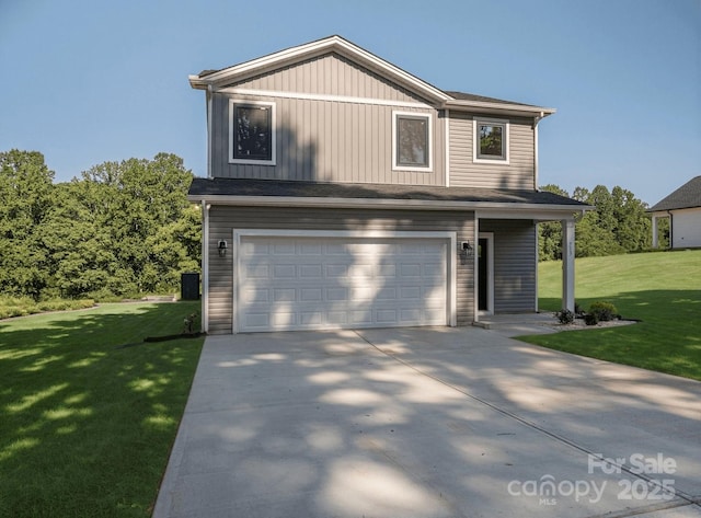 713 32nd St NE, Conover, NC 28613 - traditional-style house featuring an attached garage, a front yard, driveway, and board and batten siding