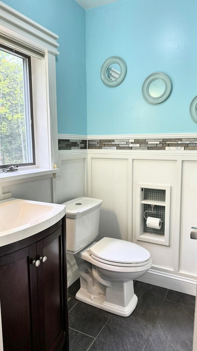 491 W Main St, Waldoboro, ME 04572 - bathroom featuring toilet, tile patterned floors, and vanity
