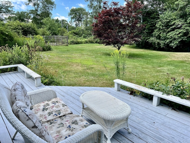 wooden terrace with a yard