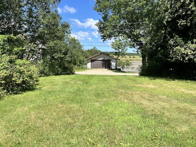 view of yard featuring a garage