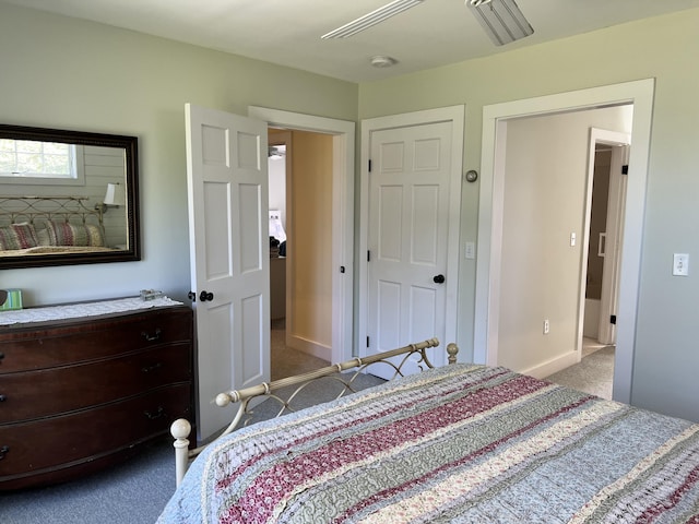 bedroom featuring dark carpet