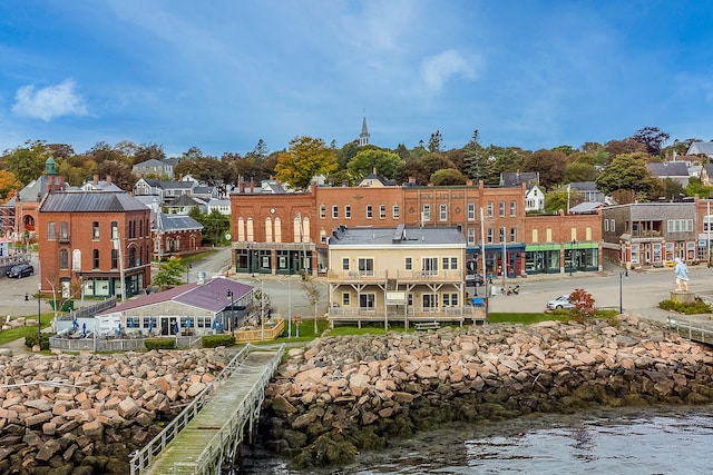 rear view of property featuring a water view