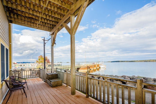 wooden terrace with a water view