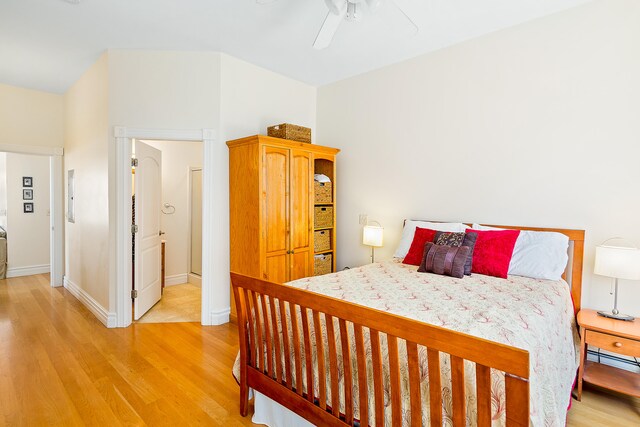 bedroom featuring ceiling fan and light hardwood / wood-style floors