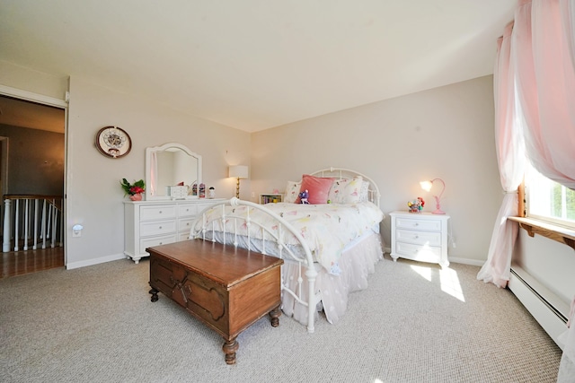 428 Main St, Orono, ME 04473 - bedroom featuring a baseboard radiator, light colored carpet, and baseboards