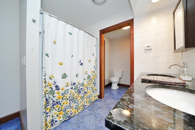 428 Main St, Orono, ME 04473 - full bath with a sink, toilet, baseboards, a shower with shower curtain, and tasteful backsplash