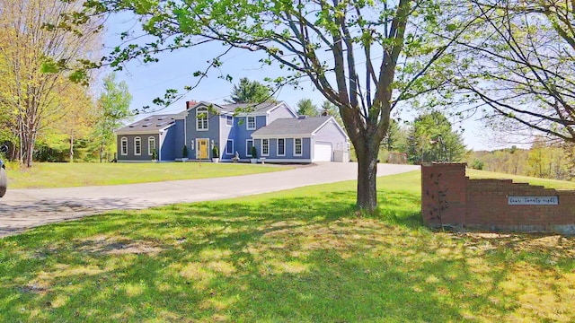 428 Main St, Orono, ME 04473 - view of front of property with a front yard, driveway, and an attached garage