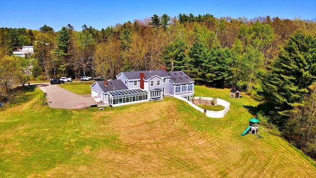 428 Main St, Orono, ME 04473 - aerial view of property and surrounding area featuring a heavily wooded area