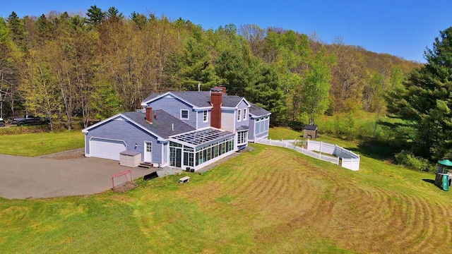 428 Main St, Orono, ME 04473 - aerial view of property and surrounding area featuring a heavily wooded area
