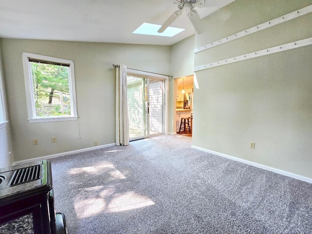 40 Willow Grove Rd, Brunswick, ME 04011 - spare room with lofted ceiling, a skylight, carpet floors, a ceiling fan, and plenty of natural light