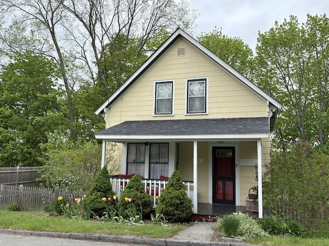 24 Glidden St, Waldoboro, ME 04572 - view of front facade featuring a shingled roof and covered porch