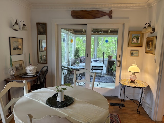 24 Glidden St, Waldoboro, ME 04572 - dining space with healthy amount of natural light, wood finished floors, ornamental molding, and baseboards