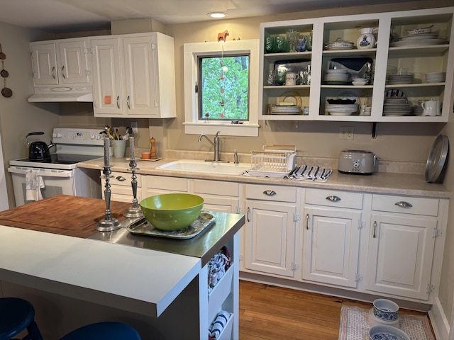 24 Glidden St, Waldoboro, ME 04572 - kitchen featuring a sink, white electric range oven, under cabinet range hood, white cabinets, and light countertops