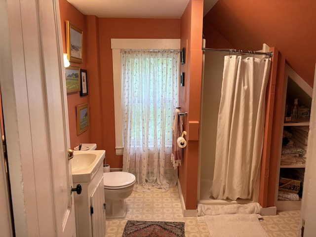 24 Glidden St, Waldoboro, ME 04572 - full bathroom featuring vanity, toilet, curtained shower, and tile patterned floors