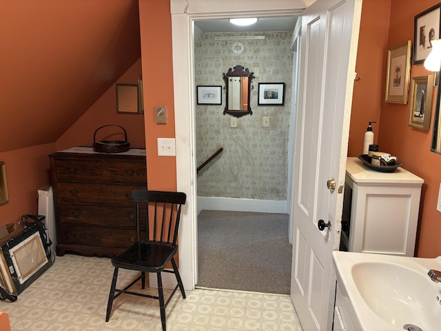 24 Glidden St, Waldoboro, ME 04572 - bathroom featuring tile patterned floors, vaulted ceiling, and vanity