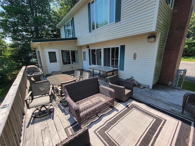 wooden terrace featuring an outdoor hangout area