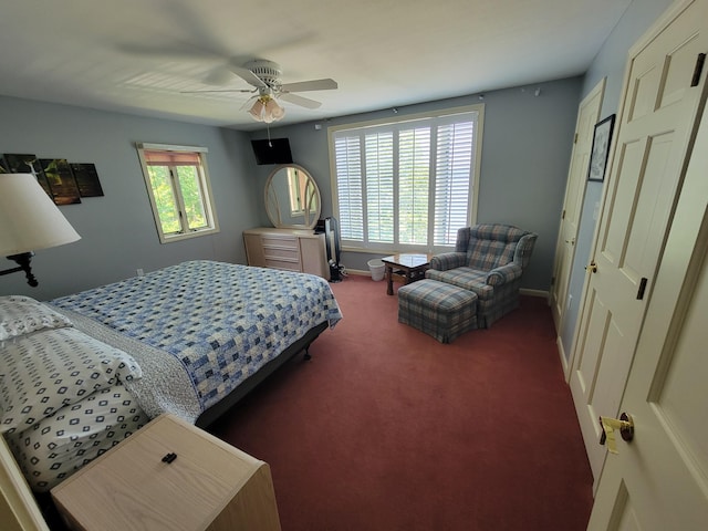 carpeted bedroom featuring a closet and ceiling fan