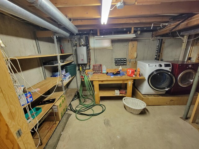 basement with independent washer and dryer and tankless water heater