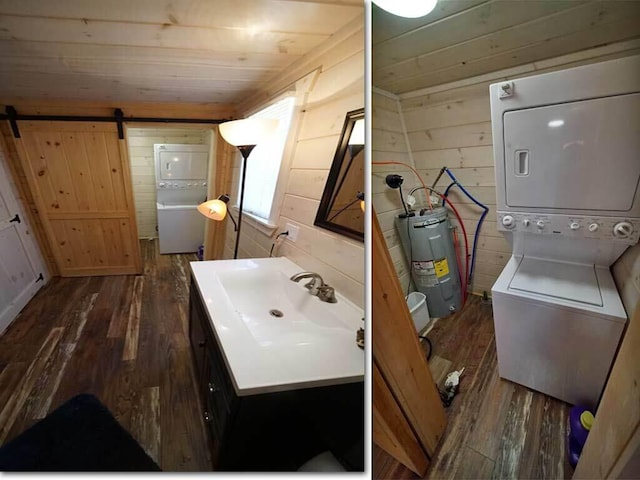 bathroom featuring wooden walls, hardwood / wood-style floors, electric water heater, and stacked washer and clothes dryer