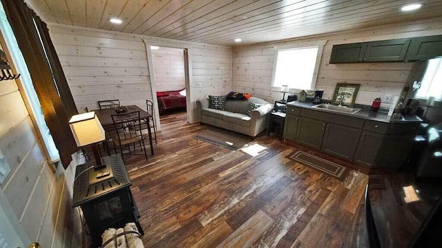 interior space with wood ceiling, wood walls, and dark hardwood / wood-style floors