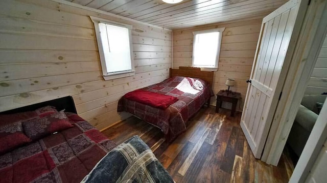 bedroom featuring wood walls, wood ceiling, and dark hardwood / wood-style flooring