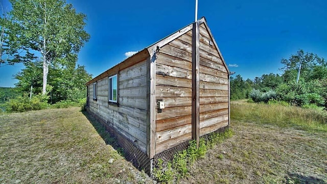 view of shed / structure featuring a yard