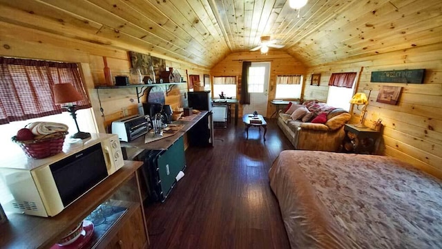 kitchen featuring dark hardwood / wood-style floors, wood ceiling, wooden walls, and vaulted ceiling