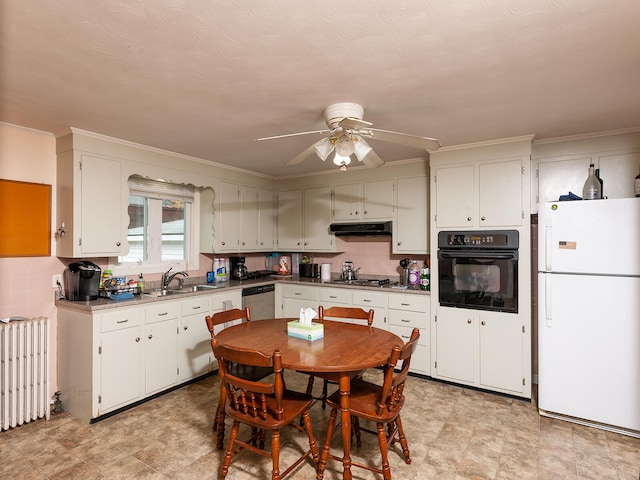 kitchen featuring appliances with stainless steel finishes, backsplash, ceiling fan, and exhaust hood