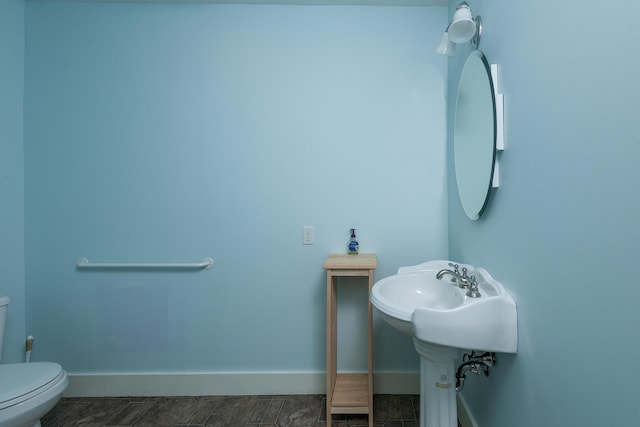 bathroom with tile flooring and toilet