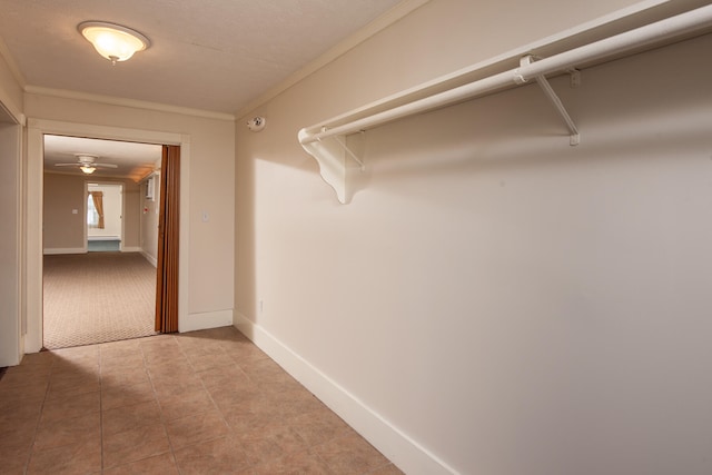 spacious closet featuring light tile floors and ceiling fan