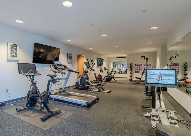 workout area with recessed lighting and baseboards