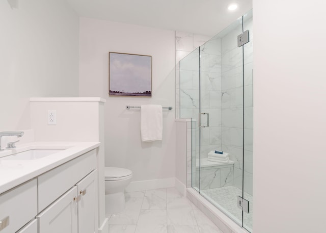 bathroom with a shower stall, marble finish floor, toilet, vanity, and baseboards