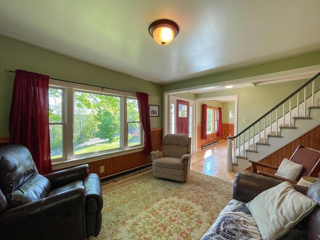 living room featuring hardwood / wood-style floors and a baseboard heating unit