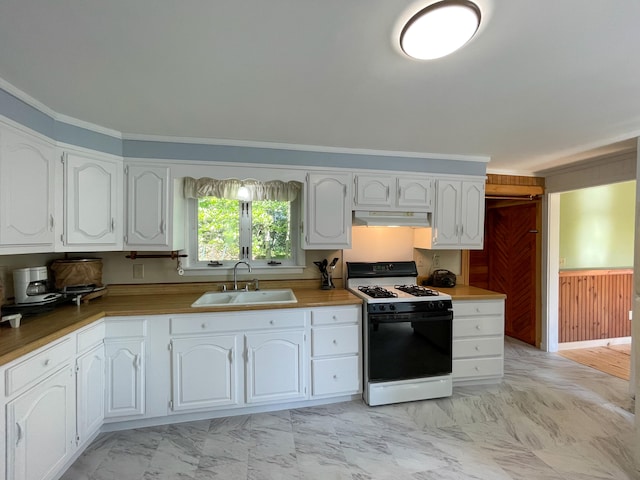 kitchen featuring white gas range oven, sink, light tile floors, and white cabinets