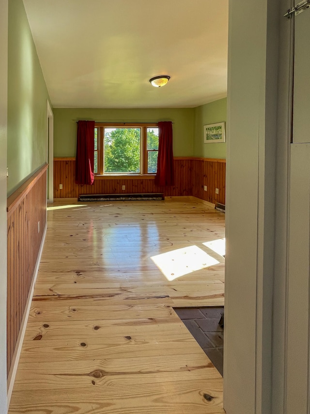 spare room with light hardwood / wood-style floors