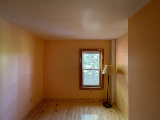 unfurnished room with light hardwood / wood-style floors