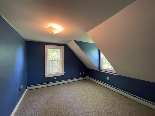 bonus room with a baseboard heating unit, lofted ceiling, and carpet