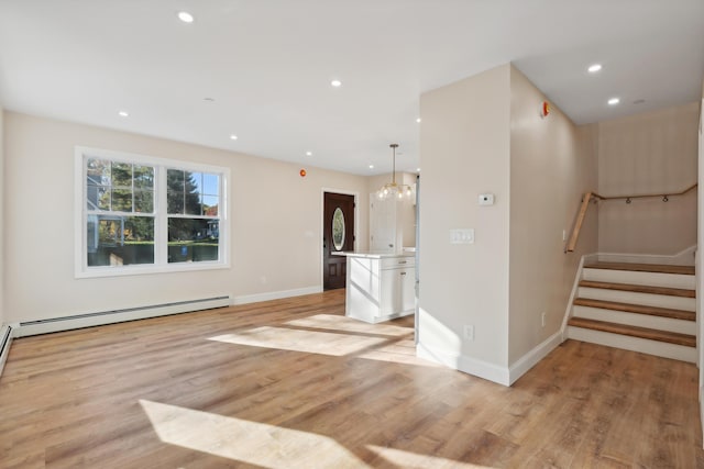 unfurnished living room featuring recessed lighting, baseboards, light wood finished floors, and a baseboard radiator