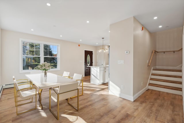 dining room with recessed lighting, baseboards, light wood-style flooring, and stairway