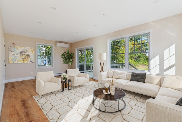 living room with baseboards, a wall mounted air conditioner, wood finished floors, and baseboard heating