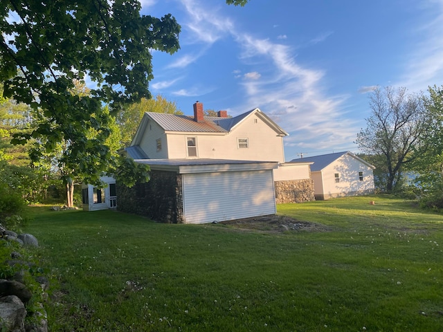 view of side of home featuring a lawn