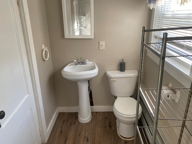 bathroom featuring toilet and hardwood / wood-style flooring