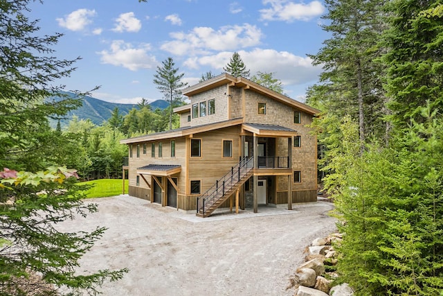 view of front of property with a mountain view