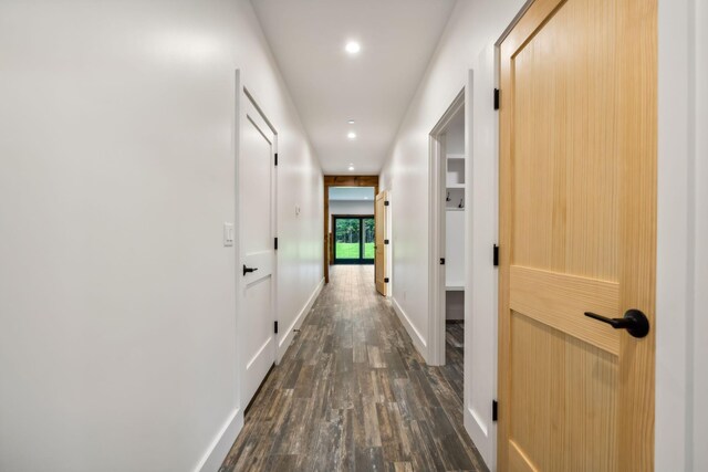 hallway with dark wood-type flooring