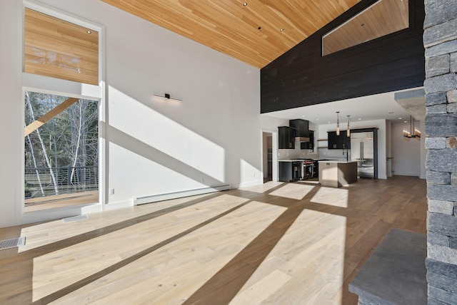 living room featuring wood ceiling, high vaulted ceiling, hardwood / wood-style floors, and a baseboard heating unit